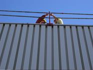 Falls from Heights: Assessment of Wood and Metal Guardrails Under Real Working Conditions